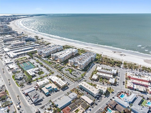 drone / aerial view featuring a view of the beach and a water view