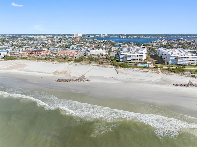 drone / aerial view featuring a water view and a beach view