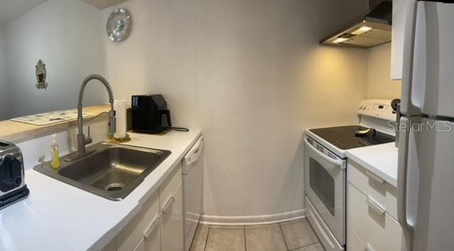 kitchen featuring white cabinets, white appliances, sink, and range hood