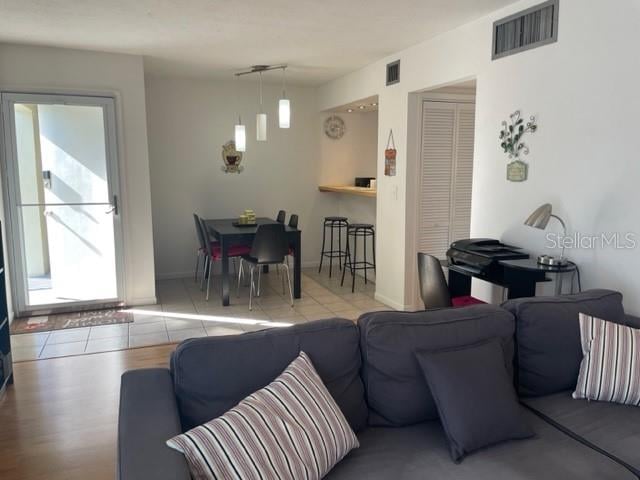 living room with light hardwood / wood-style flooring