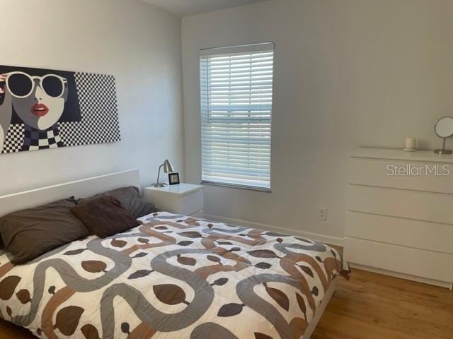 bedroom featuring wood-type flooring