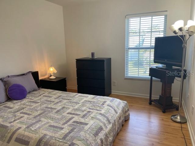 bedroom featuring wood-type flooring