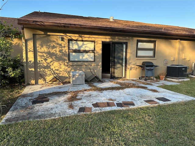 back of property with central AC unit