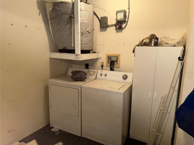 clothes washing area with separate washer and dryer