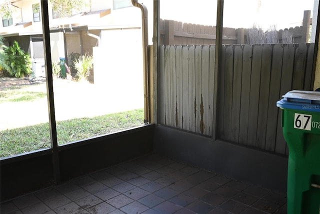 unfurnished sunroom with radiator heating unit