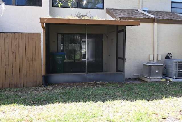 entrance to property featuring central AC