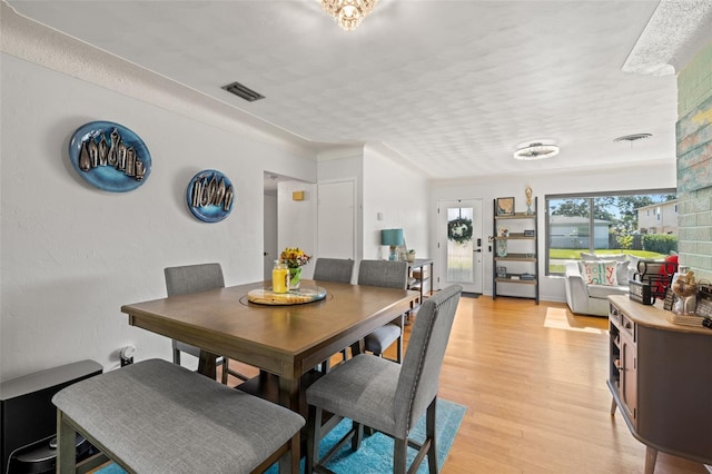 dining room with light hardwood / wood-style floors