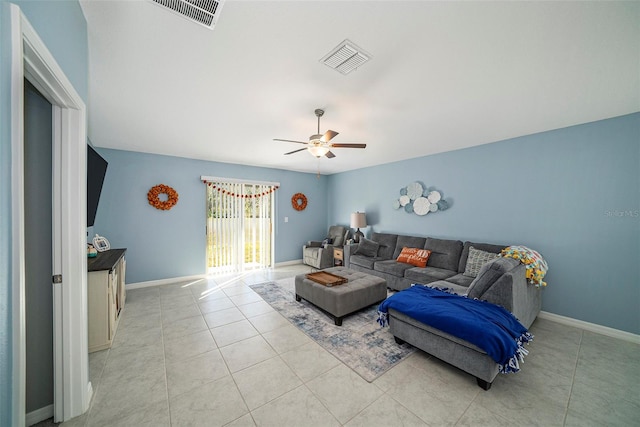 living room featuring light tile patterned floors and ceiling fan