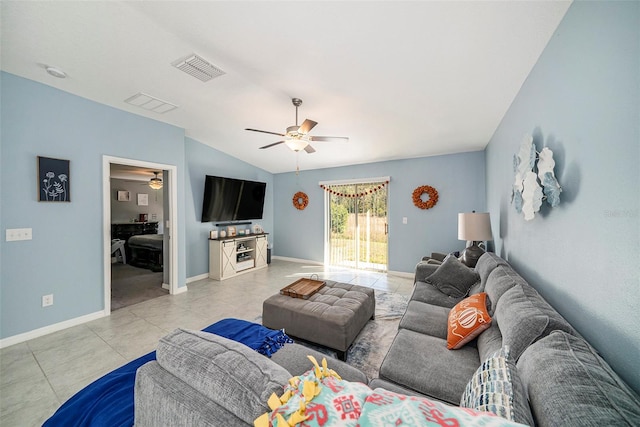 living room featuring light tile patterned flooring and lofted ceiling