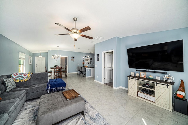 living room featuring vaulted ceiling, tile patterned floors, and ceiling fan with notable chandelier