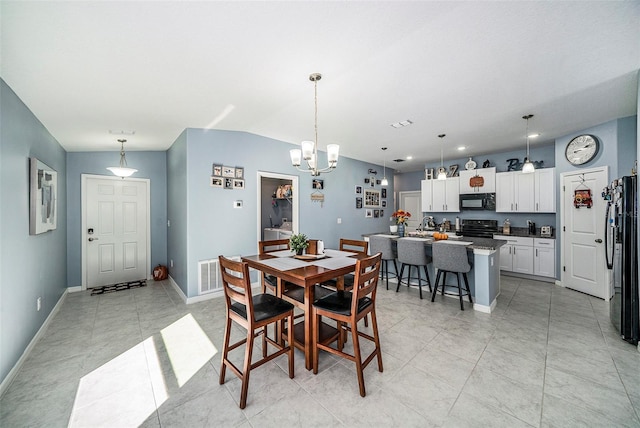 dining area with a chandelier