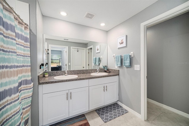 bathroom featuring vanity and tile patterned floors