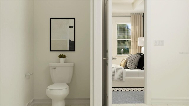 bathroom with tile patterned floors and toilet