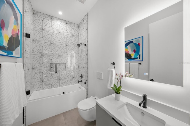 full bathroom with toilet, tile patterned floors, tiled shower / bath, and vanity