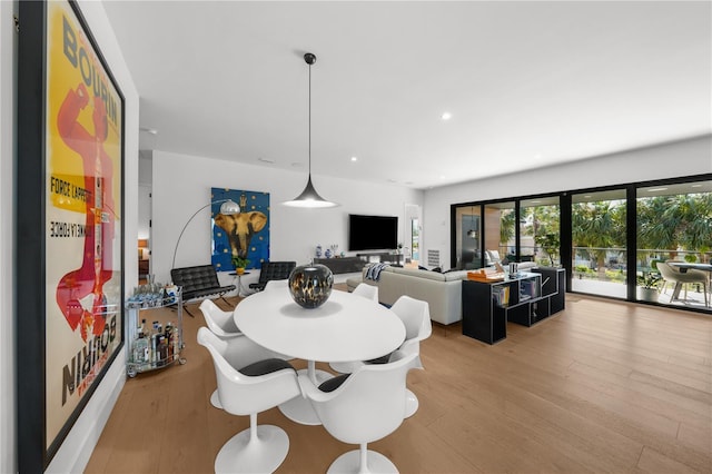 dining space with light wood-type flooring