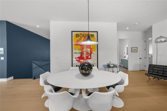 dining area featuring light wood-type flooring