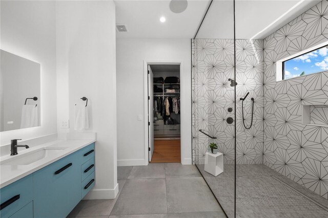 bathroom with walk in shower, vanity, and concrete flooring