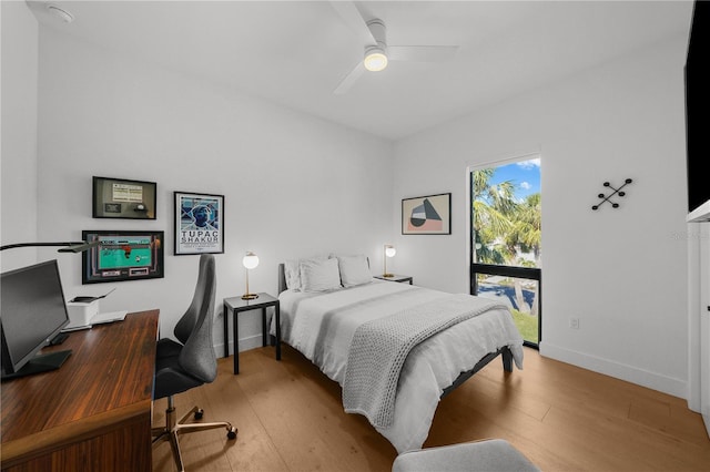 bedroom with ceiling fan, light hardwood / wood-style flooring, and access to outside