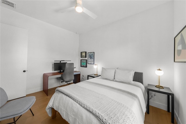 bedroom featuring ceiling fan and light hardwood / wood-style flooring