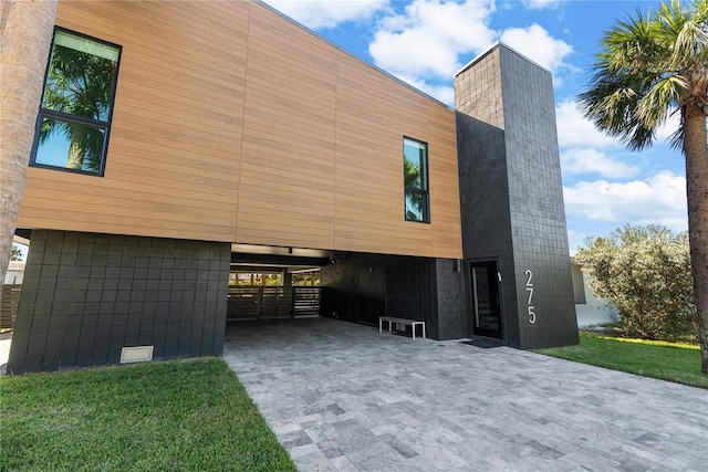 view of side of property featuring a carport