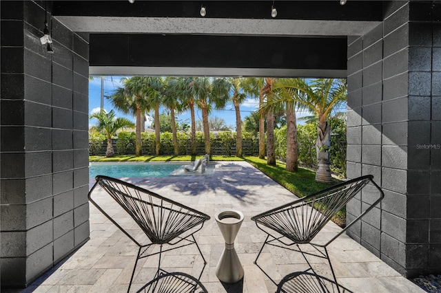 view of patio / terrace featuring a fenced in pool