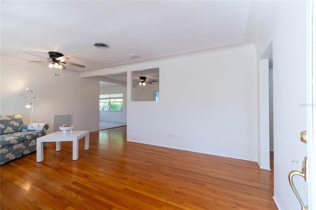 unfurnished living room featuring hardwood / wood-style flooring