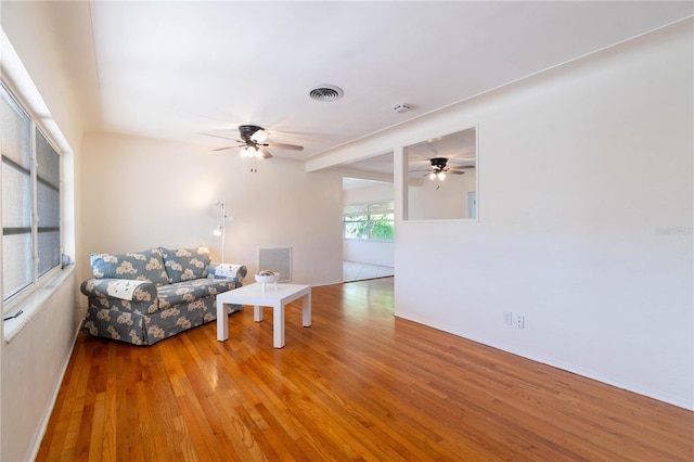 unfurnished room featuring hardwood / wood-style flooring and ceiling fan