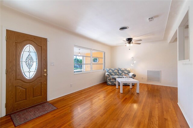 entryway with ceiling fan and light wood-type flooring