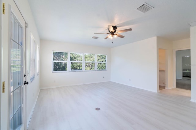 empty room featuring light wood-type flooring and ceiling fan