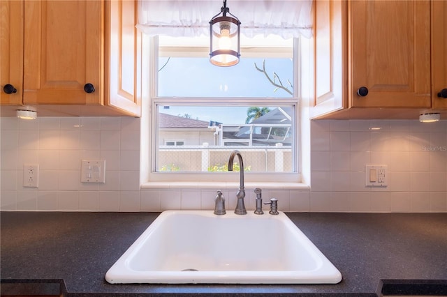 kitchen featuring decorative backsplash and sink