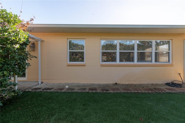 view of home's exterior featuring a yard