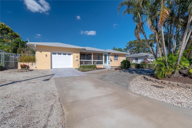 ranch-style home featuring a garage