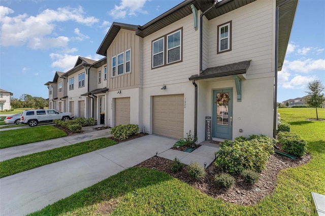 multi unit property featuring a garage