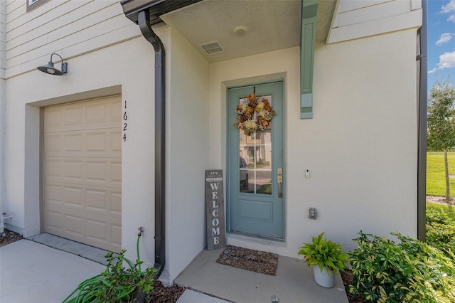 property entrance featuring a garage