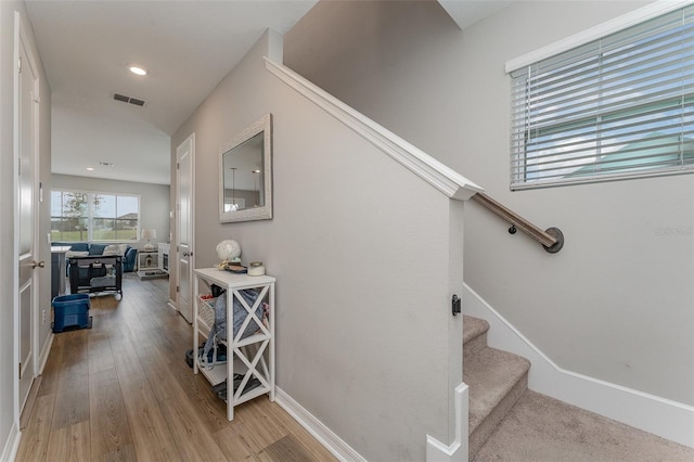 staircase featuring hardwood / wood-style floors