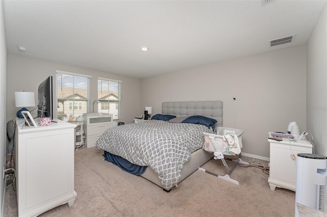 bedroom featuring light colored carpet