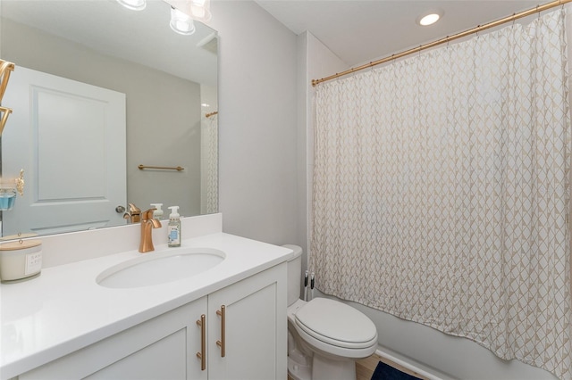 full bathroom with vanity, toilet, and shower / tub combo with curtain