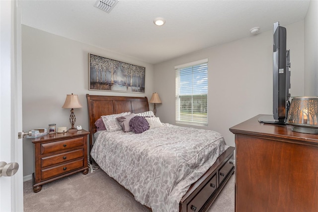 bedroom with light colored carpet