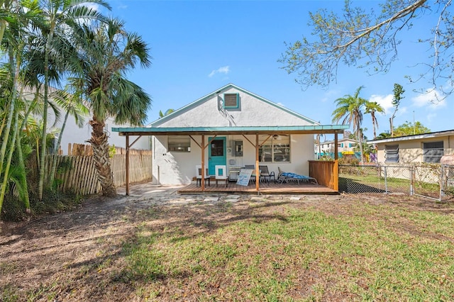 rear view of property with a yard