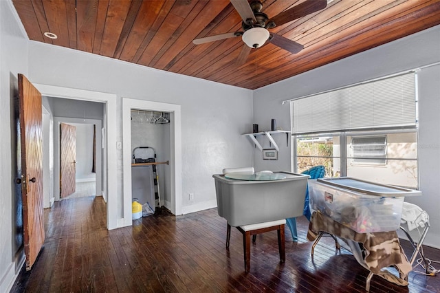 miscellaneous room featuring wooden ceiling, ceiling fan, and dark wood-type flooring