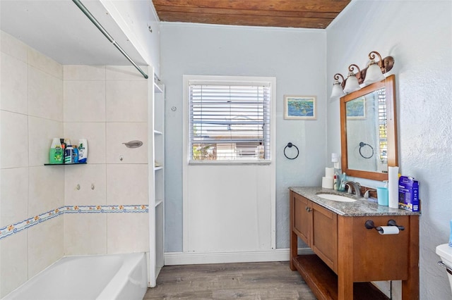 full bathroom featuring washtub / shower combination, hardwood / wood-style floors, toilet, vanity, and wood ceiling