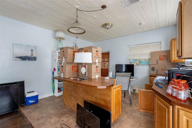 kitchen with pendant lighting, wood ceiling, and track lighting