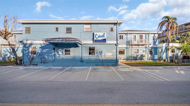483 E Shore Dr Unit D4, Clearwater Beach, FL 33767 - view of building exterior featuring uncovered parking