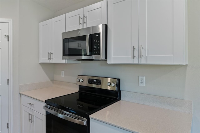 kitchen with white cabinets and stainless steel appliances