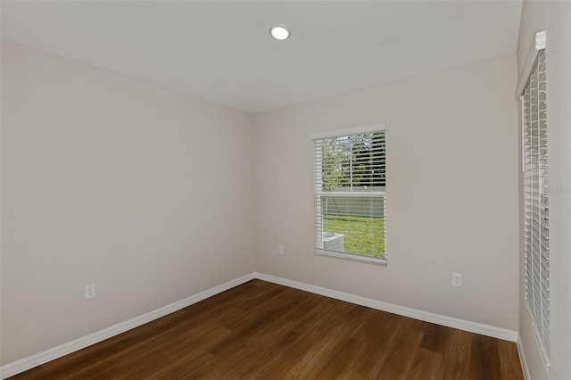 unfurnished room featuring dark hardwood / wood-style floors