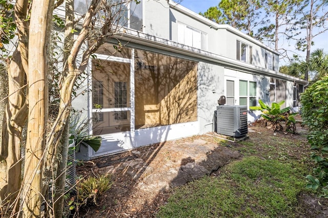 view of home's exterior with central AC unit