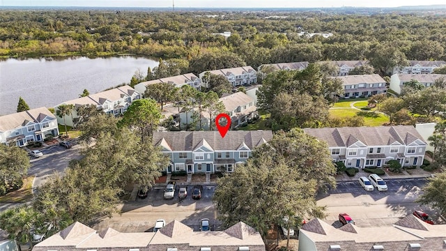 birds eye view of property featuring a water view