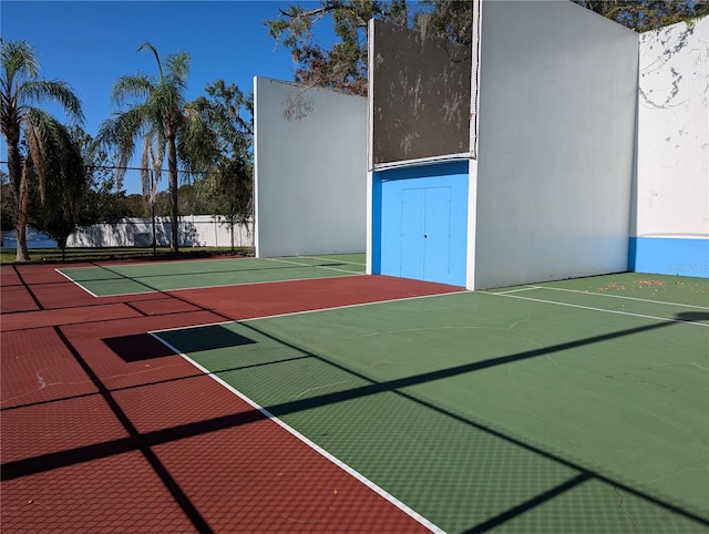 view of sport court featuring basketball hoop