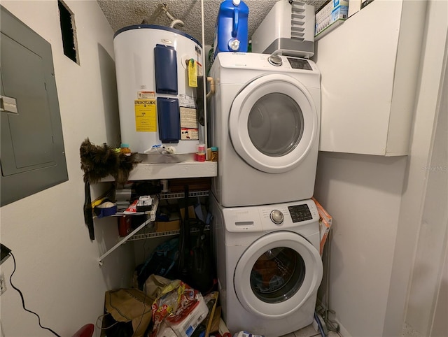 laundry room with electric water heater, stacked washer / dryer, and electric panel