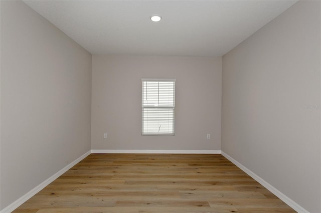 spare room with light hardwood / wood-style flooring